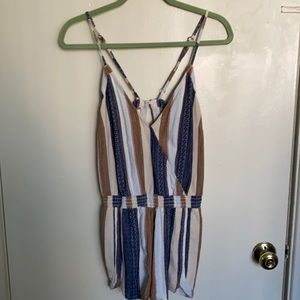 Super cute romper with open back!